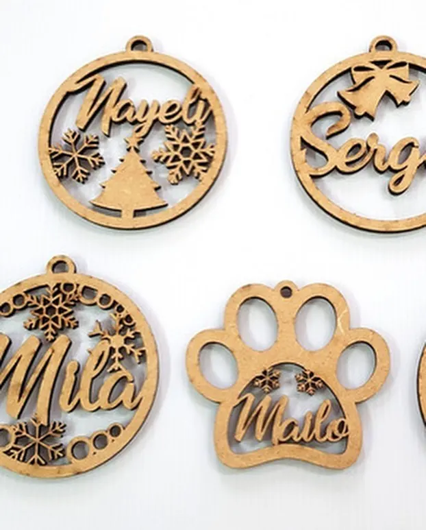 Laser-cut wooden Christmas ornaments with names