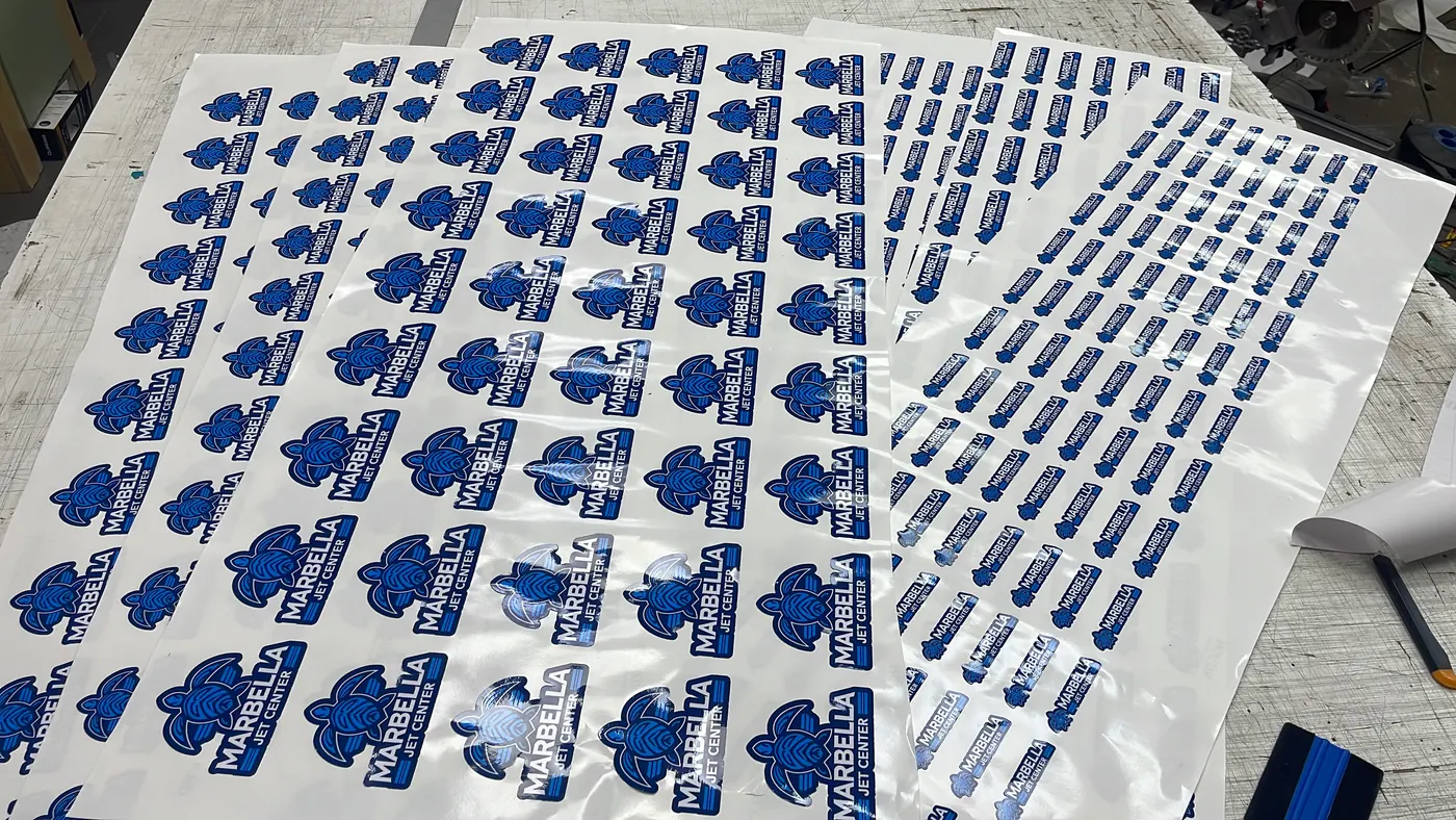Sheets of blue vinyl logo stickers